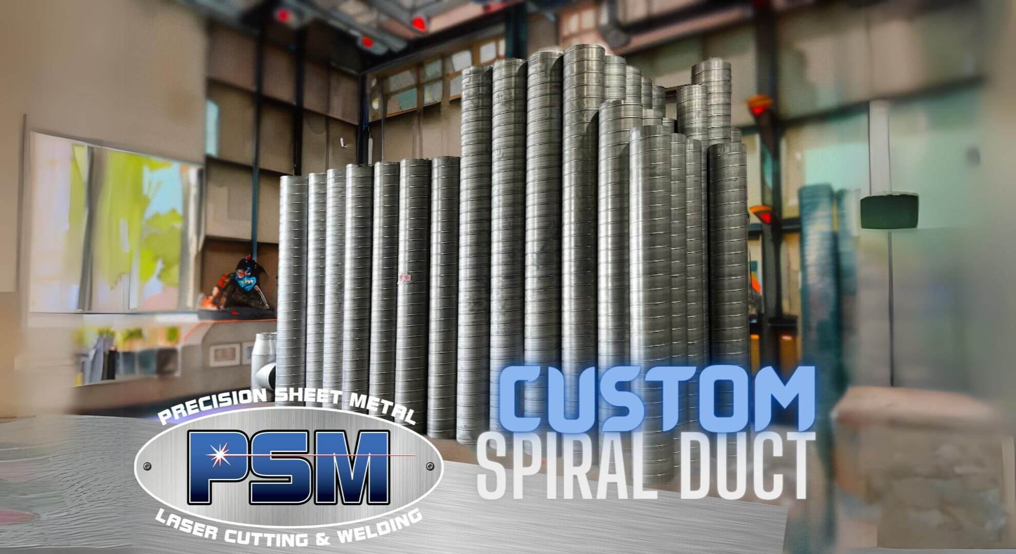 custom ductwork graphic with logo and rolls of finished duct stacked on floor